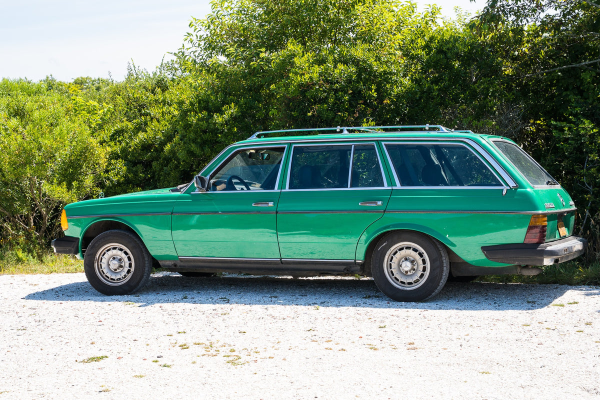 An emerald wagon finds its natural company in the deep greens of a Nantucket summer.